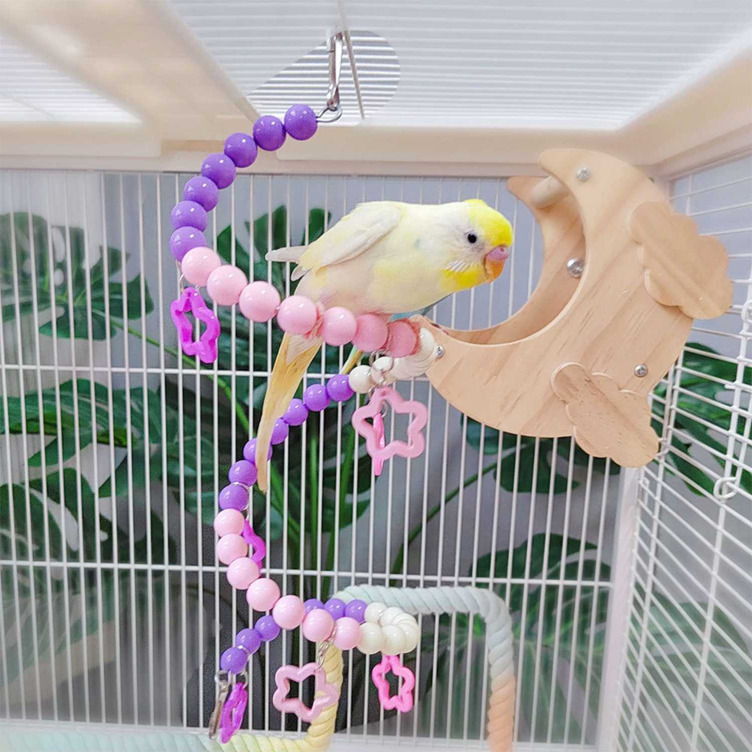 vogel speelbrug met vogel zittend op spiraalvormige kralenslinger